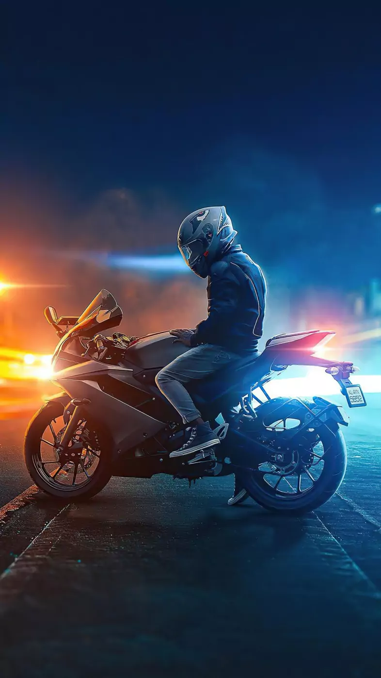 biker on road lights wallpaper