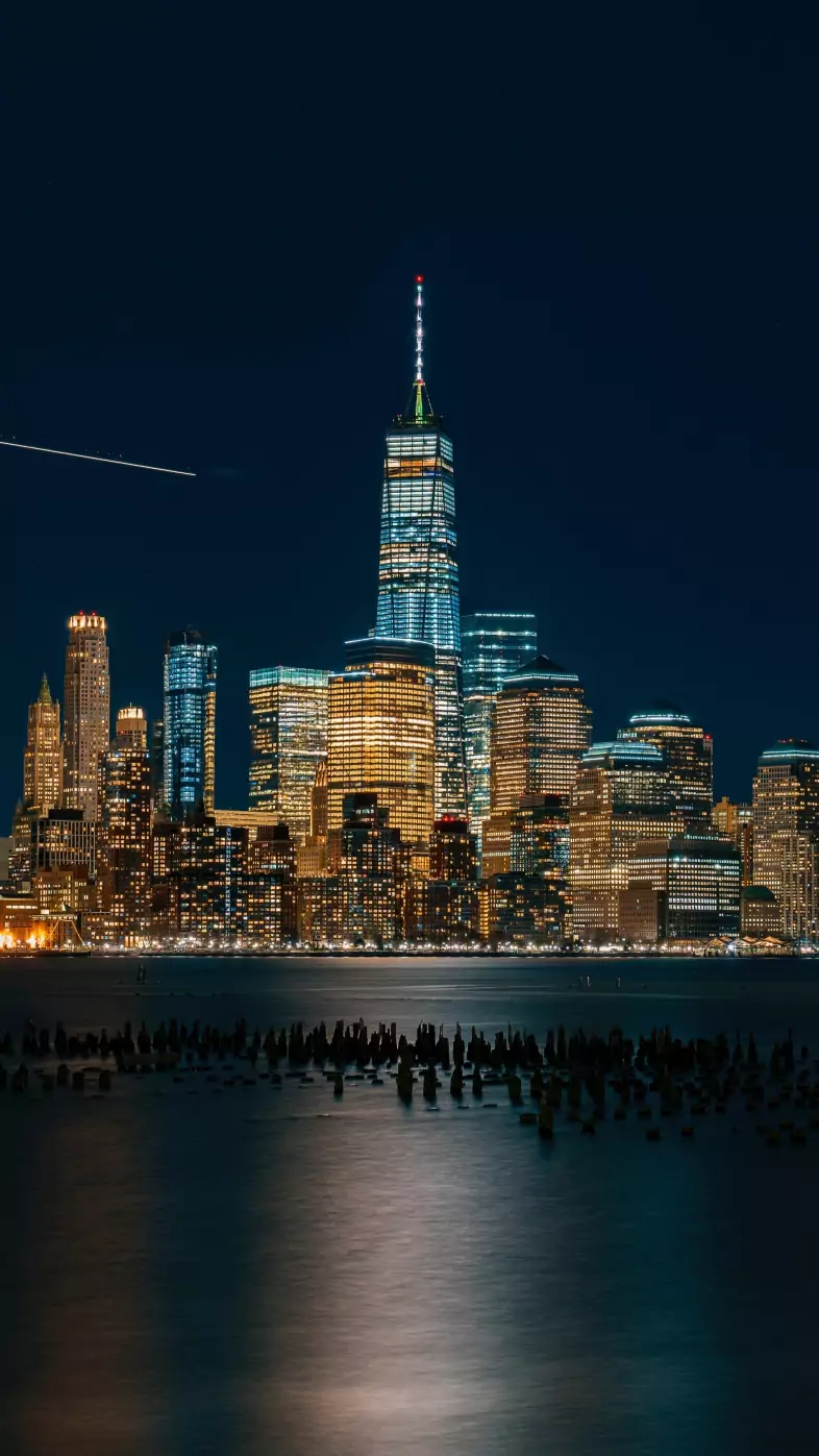 city lights reflection in water wallpaper