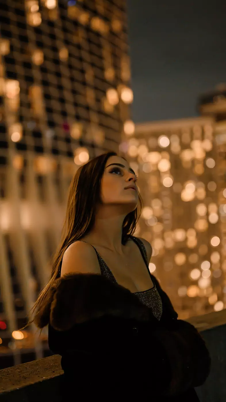girl in city skyline at night wallpaper