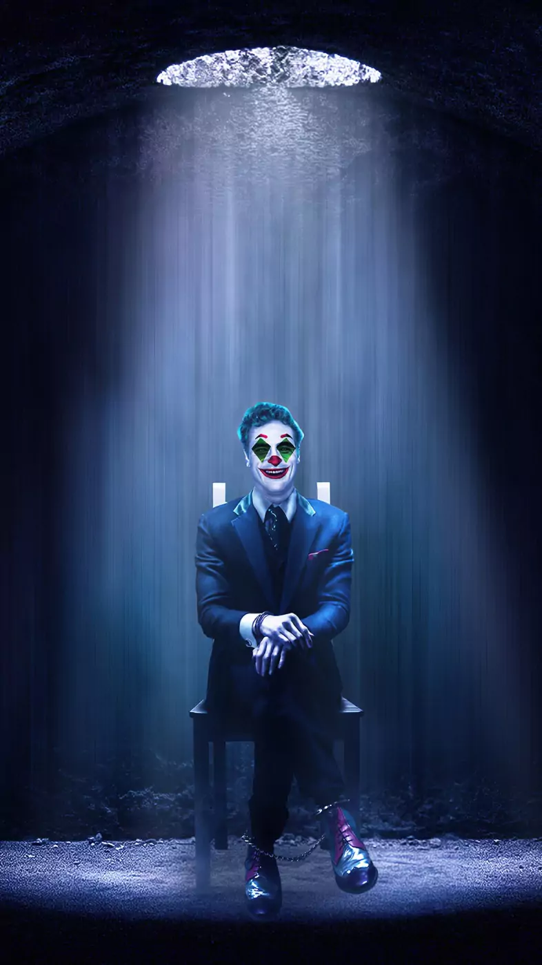 joker sitting on chair wallpaper