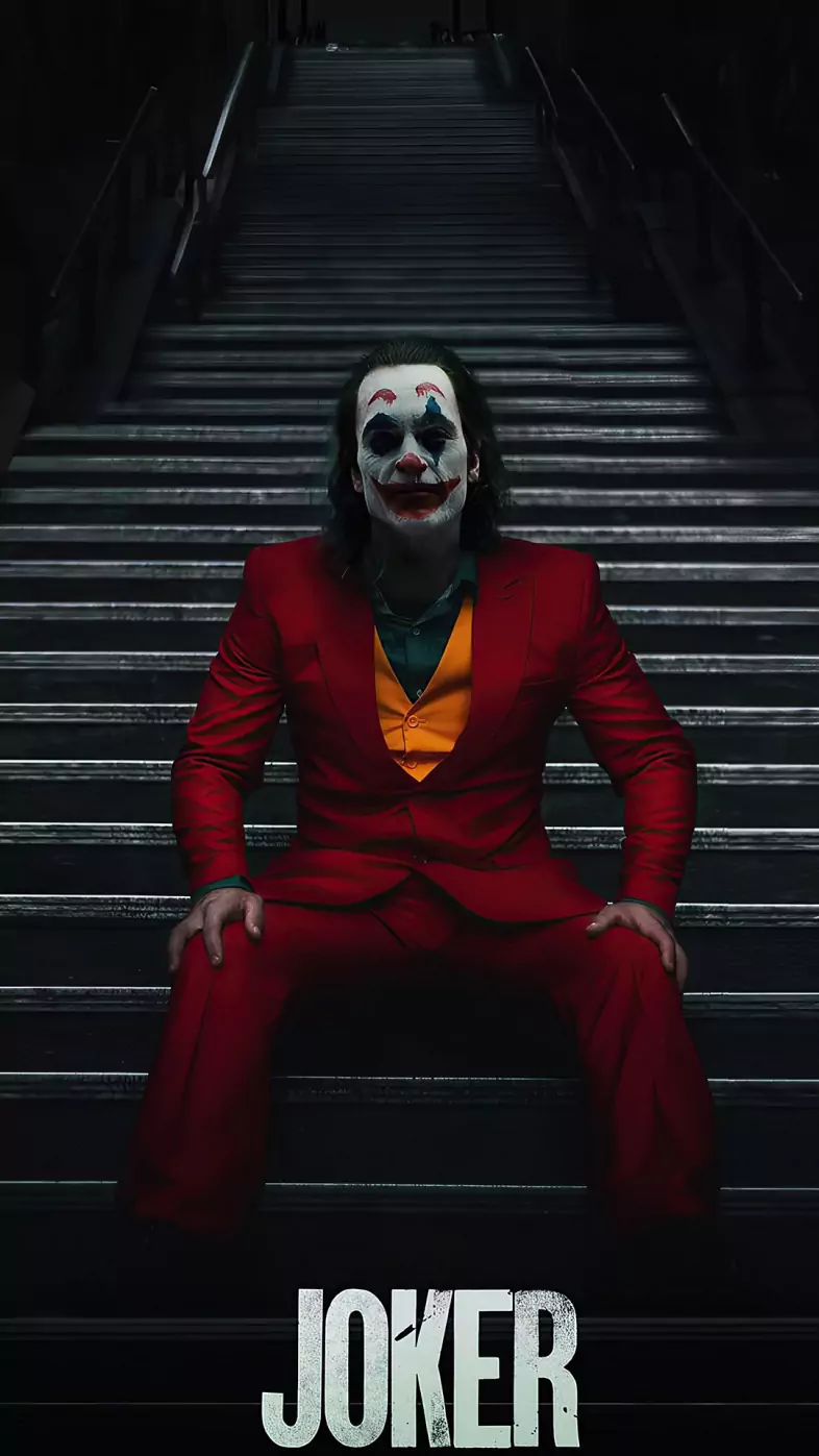 joker sitting on stairs wallpaper